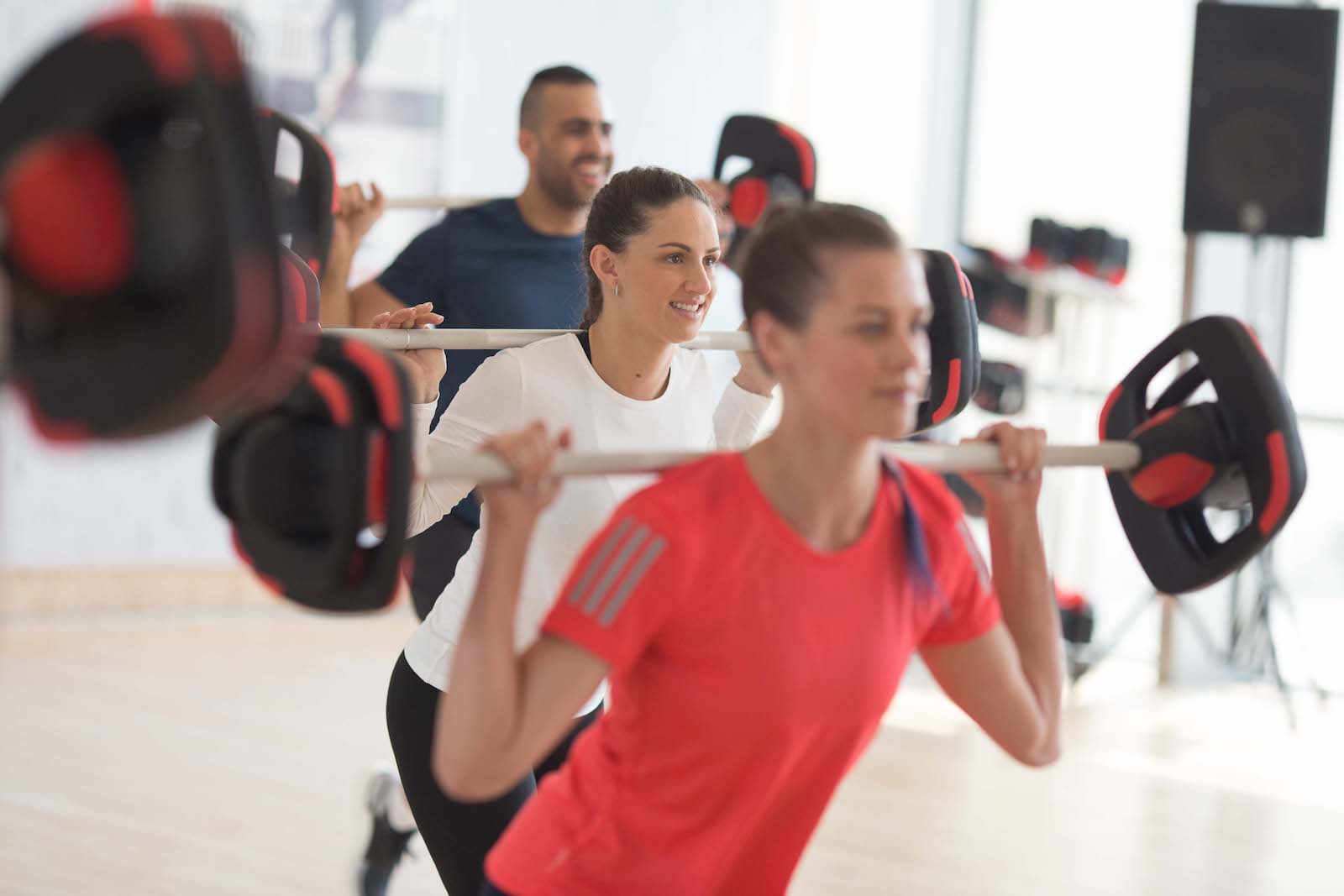 Weight bar squat group exercise Weight bar squat group exercise