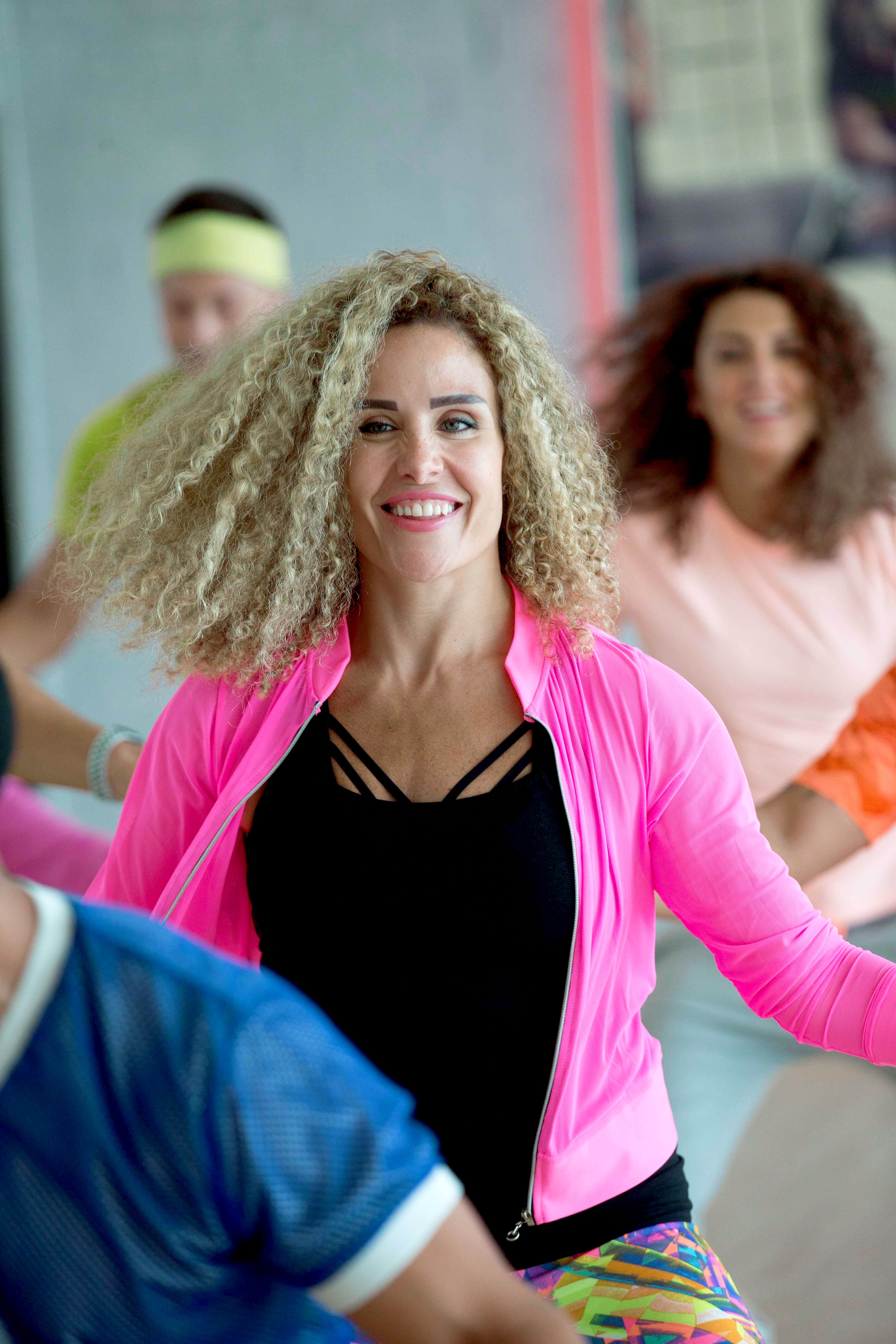 women in a group dance class women in a group dance class