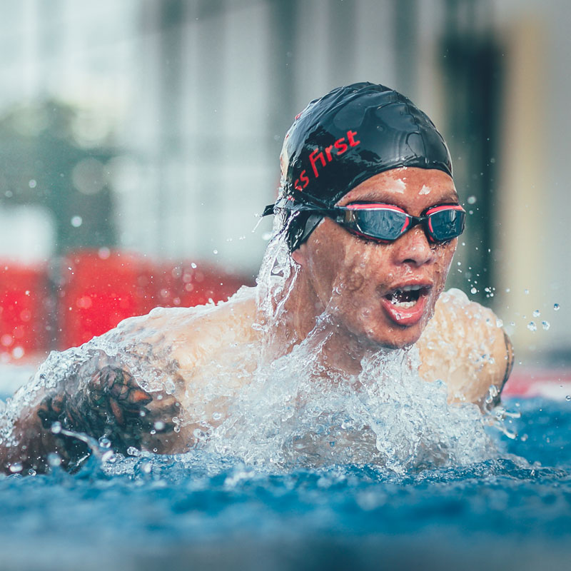 Young man swimming in Fitness First pool Young man swimming in Fitness First pool