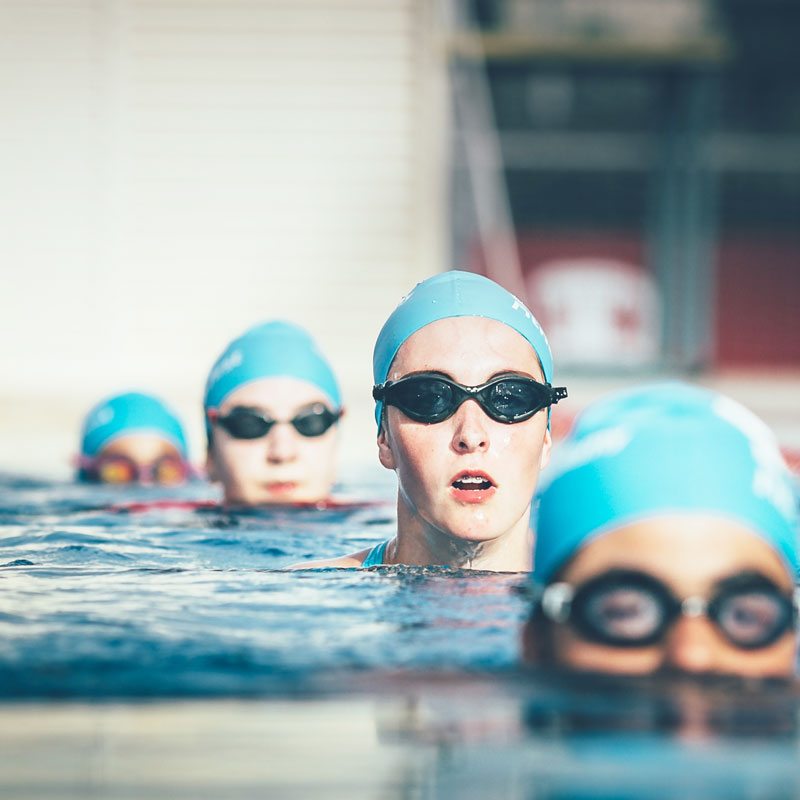 Teens ready for training in swimming pool Teens ready for training in swimming pool