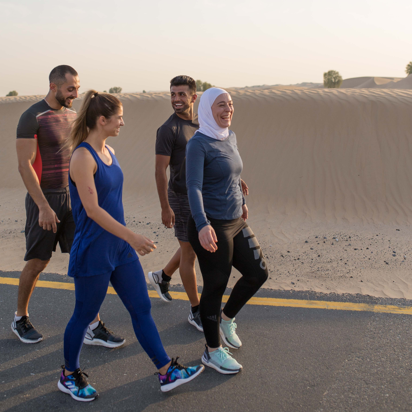 Fitness First members walking in the desert Fitness First members walking in the desert